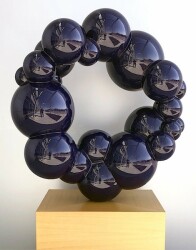 A circle of glossy stainless-steel balls creates ‘Anomaly,’ a compelling contemporary indoor sculpture.