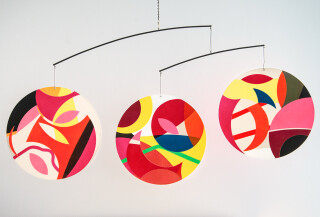 Dynamic and whimsical, Aron Hill’s mobile is a joyful contemporary kinetic sculpture.
