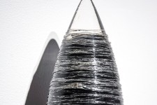 Threads of silver and clear on black glass create shimmering texture in this unique wall sculpture by Julia Reimer. Image 5