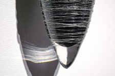Threads of silver and clear on black glass create shimmering texture in this unique wall sculpture by Julia Reimer. Image 3