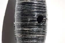 Threads of silver and clear on black glass create shimmering texture in this unique wall sculpture by Julia Reimer. Image 4