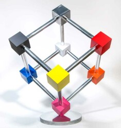 In this dynamic sculpture by Phillipe Pallafray, an open 3D stainless steel cube; each point connected by a brightly coloured solid cube in …