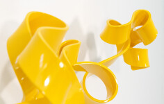As elegant as a cursive signature, this bright yellow contemporary wall sculpture was created by Stefan Duerst. Image 2
