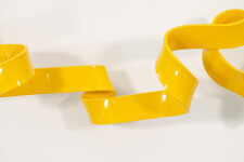 As elegant as a cursive signature, this bright yellow contemporary wall sculpture was created by Stefan Duerst. Image 4