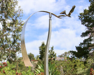 The majesty of an eagle as it soars through the air is captured in this stunning contemporary sculpture by Amos Robinson.