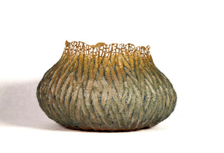 Ceramic artist Bill Greaves hand forms each vessel he creates by coiling, scraping and carving clay into voluptuous organic shapes.