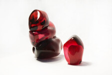 A grouping of luscious pomegranate red glass and one single seed. Image 7