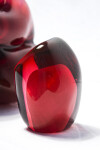 A grouping of luscious pomegranate red glass and one single seed. Image 6