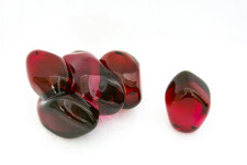 A grouping of luscious pomegranate red glass and one single seed. Image 3