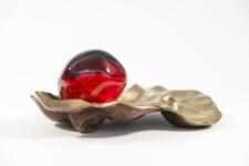 Luscious pomegranate red glass nesting in a bronze casing. Image 4