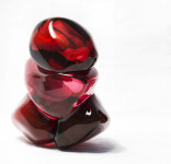 A grouping of luscious pomegranate red glass and one single seed. Image 4