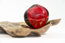 Luscious pomegranate red glass nesting in a bronze casing. Image 7