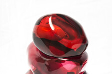A grouping of luscious pomegranate red glass and one single seed. Image 2