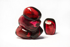 A grouping of luscious pomegranate red glass and one single seed. Image 8