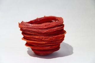 In a stunning warm red, this table top glass sculpture was created by Cheryl Wilson-Smith.
