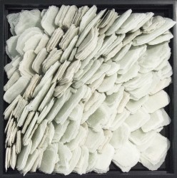 Layered petals of white glass frit are composed within a black lacquer frame by artist Cheryl Wilson-Smith.