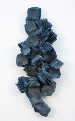 In this dynamic wall sculpture by Cheryl Wilson-Smith fine layers of glass frit squares (ground glass) in indigo blue are stacked to create …