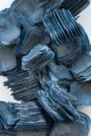 In this dynamic wall sculpture by Cheryl Wilson-Smith fine layers of glass frit squares (ground glass) in indigo blue are stacked to create … Image 4