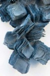 In this dynamic wall sculpture by Cheryl Wilson-Smith fine layers of glass frit squares (ground glass) in indigo blue are stacked to create … Image 5