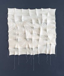In this subtle but striking felt tapestry of white and gray, fabric artist, Chung-Im Kim mimics the natural shifting patterns of sand.