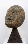 Old metal type, welded together to form the head of this oversized bust, is cast in bronze and perched on a bronze pyramidal base. Image 3