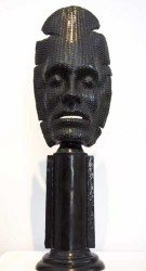 This powerful and haunting life-sized mask by Dale Dunning is cast in bronze and sits on its own pedestal.