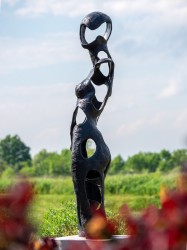 Toronto-based sculptor David Fisher explores the effects of positive and negative space in this cast bronze outdoor sculpture.