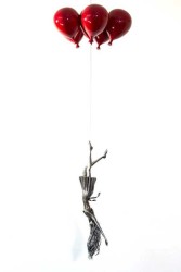 In this piece, Derya Ozparlak's stunning steel figure of a woman hangs upside down, her long hair trailing behind her as she's carried away …