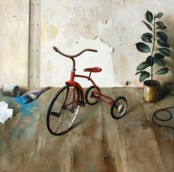 A red tricycle and green floor plant are set in a dilapidated room with wallpaper peeling from the wall, exposed dry wall screws, and a stai…