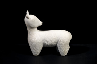 Sculpted from white Carrara marble, this charming table top sculpture of a goat is by Doug Robinson.