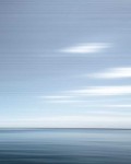 Various shades of steel grey and prussian blue stretch horizontally across this calming seascape.This image was taken with a slow shutter sp… Image 3