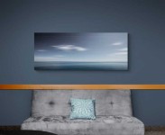 Various shades of steel grey and prussian blue stretch horizontally across this calming seascape.This image was taken with a slow shutter sp… Image 5