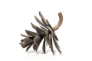 Hand forged from bronze; this delightful tabletop sculpture of a pine cone is by Floyd Elzinga.