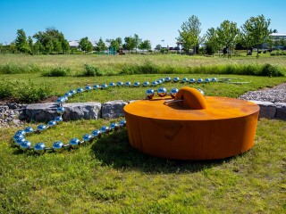 Next to the Oeno Gallery pond is Floyd Elzinga's playful and Pop art inspired outdoor sculpture Universal Stopper.