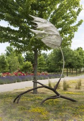Bent back against a fictional gust of wind, this sculpture of a maple leaf by Floyd Elzinga captures the essence of forces both gentle and d…