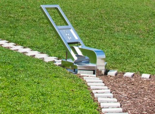 Unzip the Earth is a playful, outdoor sculptural installation consisting of a polished and reflective steel zipper handle and concrete brick…