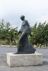 Using simplified shapes, artist Frances Semple reveals the emotive essence of movement in this bronze sculpture of a walking woman.