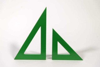 Two striking triangles in bright apple green steel; their center cut-out triangles stand beside one another in this new tabletop sculpture b…