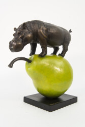 A bronze hippo sits atop a green pear in this playful tabletop sculpture by Australia’s artistic duo, Gillie and Marc.