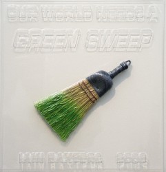 An actual straw hand broom dipped in green floats at an angle beneath embossed words 