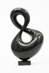 With its fluid and elegant lines, this abstract stone sculpture by Jeremy Guy appears to resemble a figure eight.