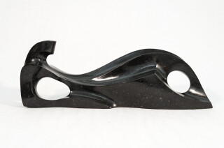 At once elegant and contemporary—this sublime sculpture of a reclining figure is by Jeremy Guy.