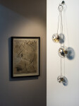 Three blown glass orbs that contain assembled clock works, wheels, sprockets and coils, hang from fine chain in this unique wall sculpture.T… Image 8