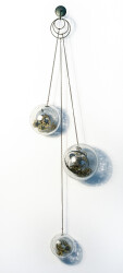 Three blown glass orbs that contain assembled clock works, wheels, sprockets and coils, hang from fine chain in this unique wall sculpture.T…