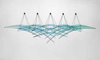 Spectacular large scale blue glass and steel wall sculpture, evoking the idea of flight, movement, and winged migrations.