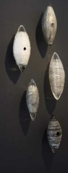White, clear, silver and black glass wall sculpture.