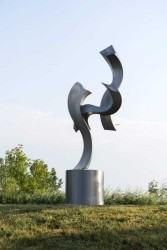 This elegant abstract metal sculpture by American artist, Kevin Robb is designed to play with natural light and shadow.