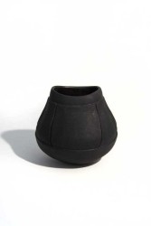 Hand crafted in black basalt clay by ceramicist Loren Kaplan, this small vessel is glazed on the interior, matte on the exterior.