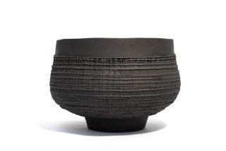 This exquisitely detailed basalt clay vessel was created by Loren Kaplan.