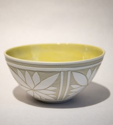 A floral motif in crisp white and soft gray decorates this beautiful ceramic bowl by Loren Kaplan.